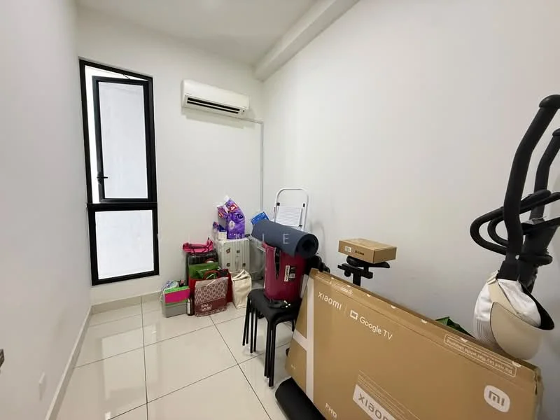 Room features: white painted walls, glossy tile flooring, 1 wall-mounted split AC, black framed window, various boxes and bags, folding chair, exercise equipment, cardboard boxes.