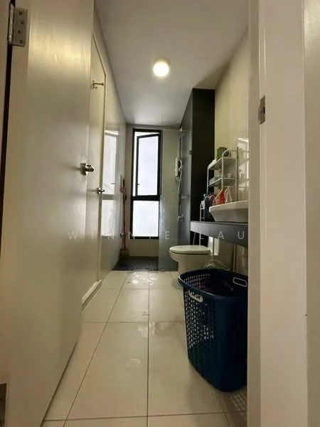 Bathroom features: white tiled walls, light grey accent wall, white ceramic floor tiles, single-sink vanity with storage, mirror above vanity, toilet, shower area with glass enclosure, window for natural light, built-in shelving unit, laundry basket, cleaning supplies visible; style: modern.