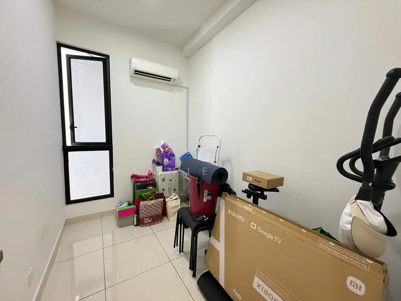 Room features: white painted walls, glossy tile flooring, 1 wall-mounted split AC, floor-to-ceiling window, black window frame, various boxes and items stacked, plastic storage bins, folding chair, exercise equipment.