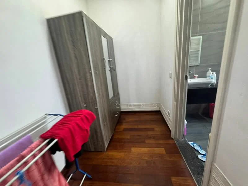 Laundry features: wooden flooring, grey wooden cabinet with glass doors, clothes drying rack, red towel, white walls, grey tiled wall in adjacent bathroom, sink, mirror.