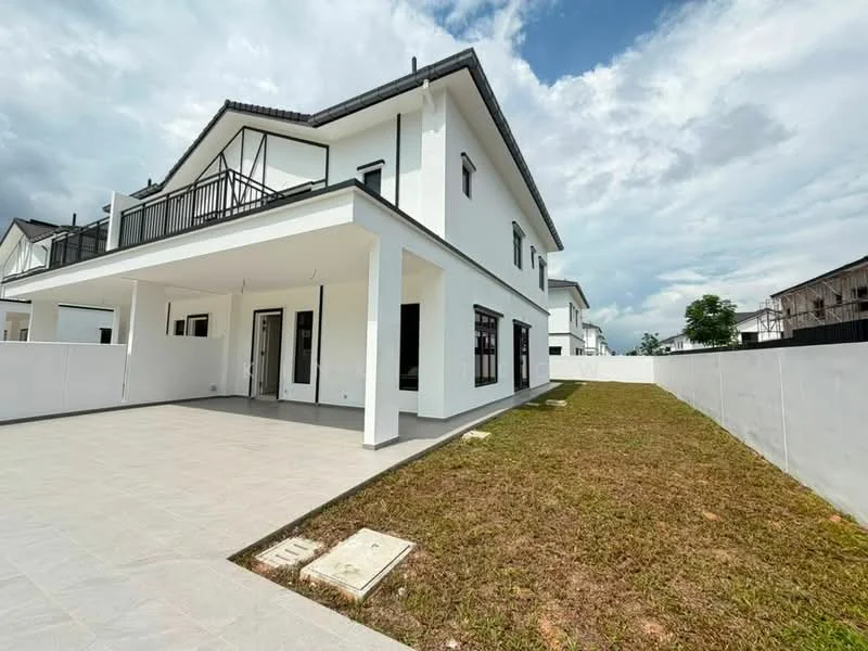 Exterior type: detached bungalow; features: white painted facade, flat roof, 2-storey, manicured lawn, paved walkway, balcony on upper floor, large windows, open outdoor space, surrounded by grass, concrete wall perimeter; style: modern.