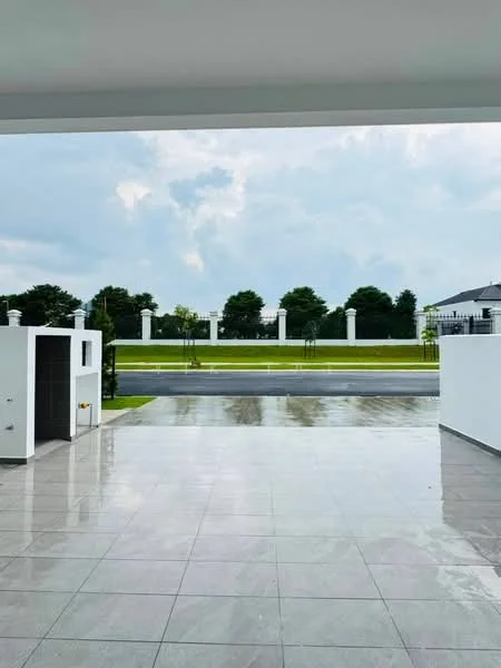 Exterior features: paved driveway, manicured lawn, white painted walls, glass sliding door, columned fence, landscaped garden, open space, concrete flooring, skyline view, overcast sky; style: modern.
