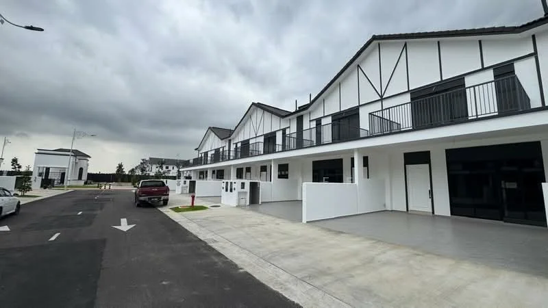 Exterior type: linked terrace house; features: white painted facade, black trim accents, pitched roof, balconies with black railings, concrete driveway, manicured landscaping, street lighting, multiple storeys, modern architectural design; style: modern.