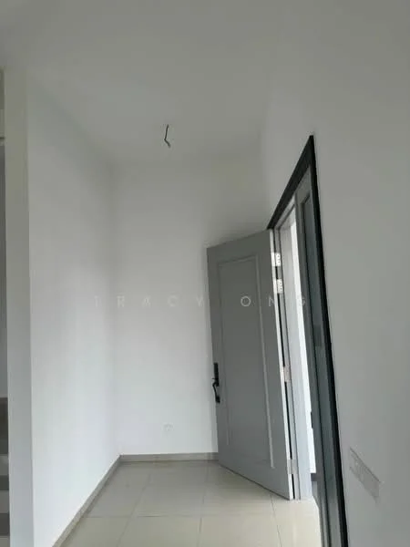 Room features: white painted walls, grey door, floor tiles, ceiling with light fixture, door frame, corner of the room, no visible furniture, neutral color scheme; style: modern.