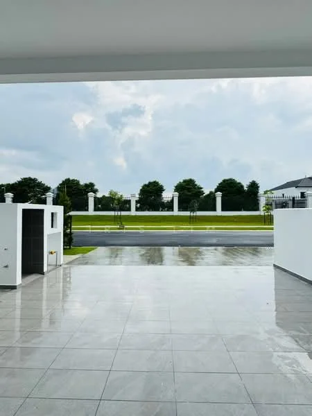 Exterior features: paved driveway, manicured lawn, white painted walls, modern fence, landscaped garden, columned entrance, concrete surface, surrounding greenery; style: modern.