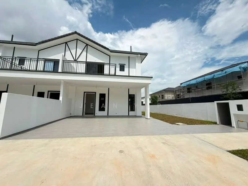 Exterior type: semi-detached house; features: white painted facade, flat roof, two-storey structure, manicured lawn, paved driveway, balcony with railing, surrounding wall, landscaped area, visible neighboring properties, clear blue sky; style: modern.