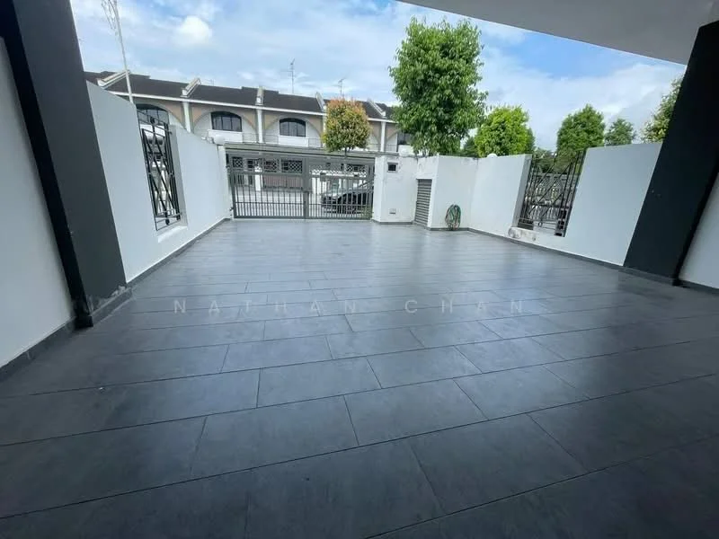 Exterior type: linked terrace house; features: grey tiled flooring, white painted walls, manicured landscaping, metal gate, fenced perimeter, open-air patio, surrounded by greenery; style: modern.
