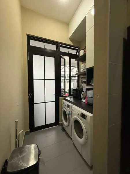 Laundry features: white front-load washing machine, white tumble dryer, black trash bin, grey tile flooring, cream painted walls, black framed glass door, open shelving, countertop with storage above; style: modern.