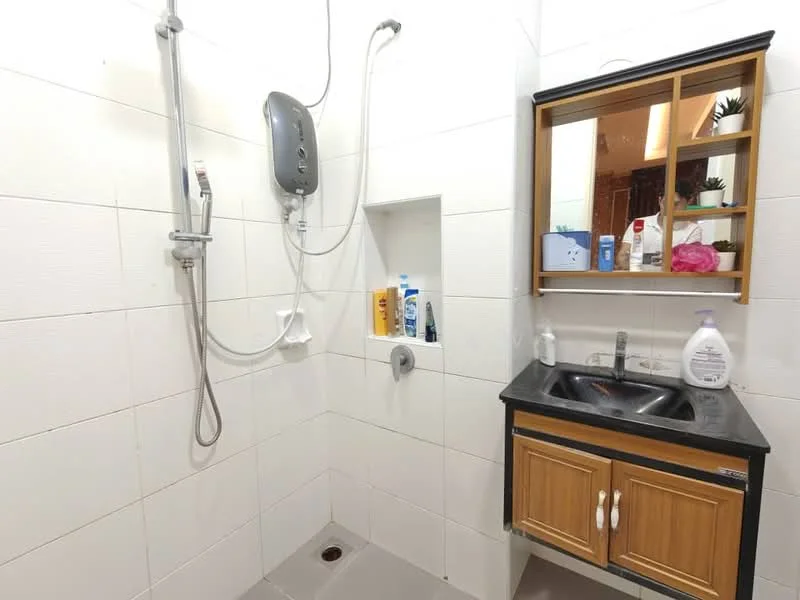 Bathroom features: white tiled walls, grey tile flooring, walk-in shower with glass enclosure, rain shower head, handheld shower, single-sink vanity with wood cabinet, black countertop, mirror above sink, shower control panel, built-in shelf in shower, various toiletries on shelf; style: modern.