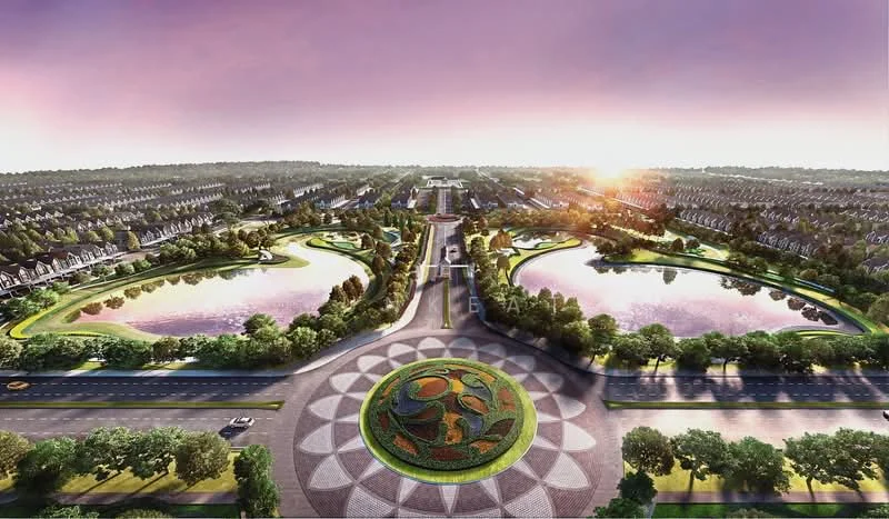 Exterior type: landscape garden; features: manicured lawns, water features with ponds, flower beds with decorative patterns, tree-lined pathways, surrounding residential buildings, sunset view, open green spaces, well-maintained landscaping; style: modern.