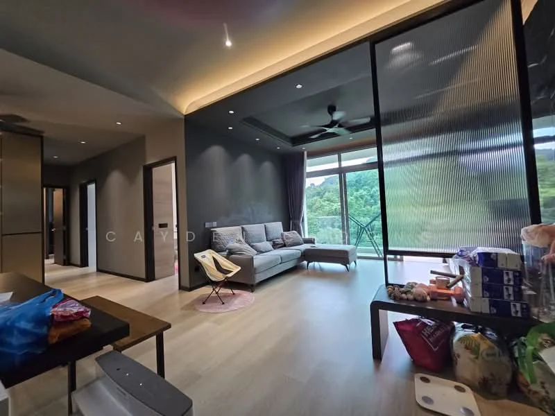Living features: 3-seater fabric sofa in grey, ceiling fan, recessed downlights, large glass sliding door, floor-to-ceiling windows, wooden flooring, decorative wall paneling, area rug, coffee table, view of greenery; style: modern; view: garden. Room features: open layout, wall with door leading to another room, light-colored walls.