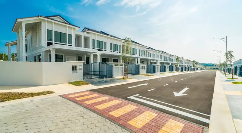 Exterior type: linked terrace house; features: two-storey linked terrace houses, white painted facade, gated entrance, manicured landscaping, paved walkway, street with road markings, street lamps, driveway with interlocking pavers, surrounding greenery, clear blue sky; style: modern.