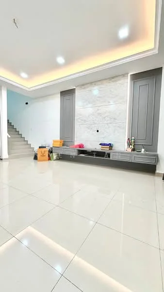 Living features: white marble accent wall, grey cabinetry, large floor tiles, recessed ceiling lights, staircase in background, neutral wall color, built-in storage, open layout; style: modern.