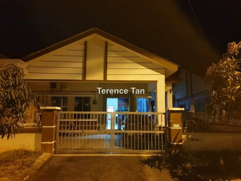 Exterior type: semi-detached house; features: white painted facade, pitched tile roof, front gate with metal bars, manicured lawn, driveway, outdoor lighting, porch area, surrounded by greenery; style: modern.
