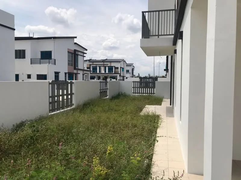 Exterior type: linked terrace house; features: white painted facade, flat roof, manicured lawn area, fenced yard, paved walkway, surrounded by other residential buildings; style: modern.