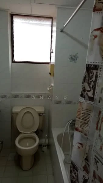 Bathroom features: white tiled walls, light grey tiled flooring, bathtub, shower curtain, toilet, sink, window, chrome faucet, wall-mounted mirror, towel rail.