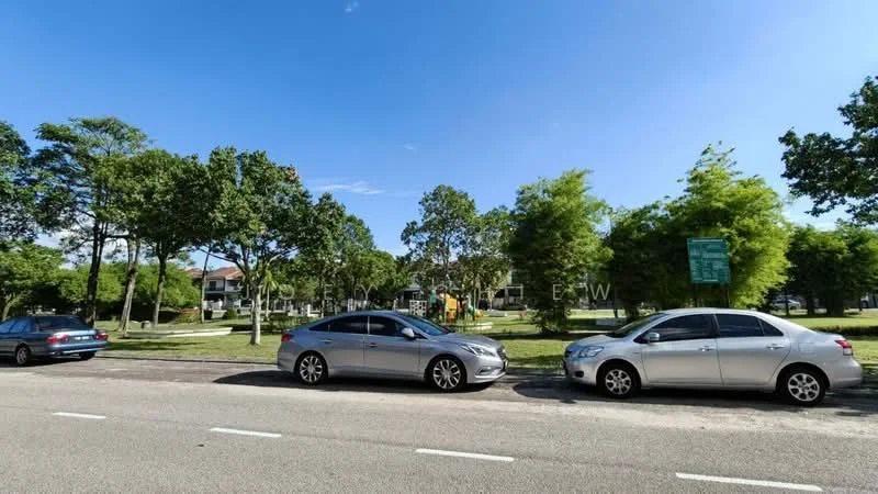 Exterior features: manicured lawn, mature trees, playground equipment, paved road, parked cars, clear blue sky.