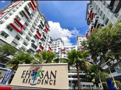 Exterior type: mid-rise condominium; features: white painted facade, red accent balconies, glass railings on balconies, manicured landscaping with palm trees, outdoor seating area, multiple storeys, modern architectural design, large windows, entrance signage, surrounded by greenery; style: modern.