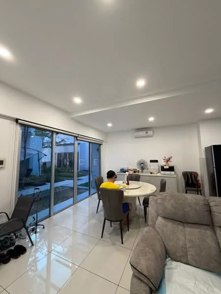 Living features: white painted walls, recessed downlights, large sliding glass door, floor-to-ceiling windows, white tiled flooring, round dining table, upholstered dining chairs, 3-seater fabric sofa in grey, air conditioning unit, ceiling fan, decorative plant, wall-mounted fan, black refrigerator; style: modern; view: garden.