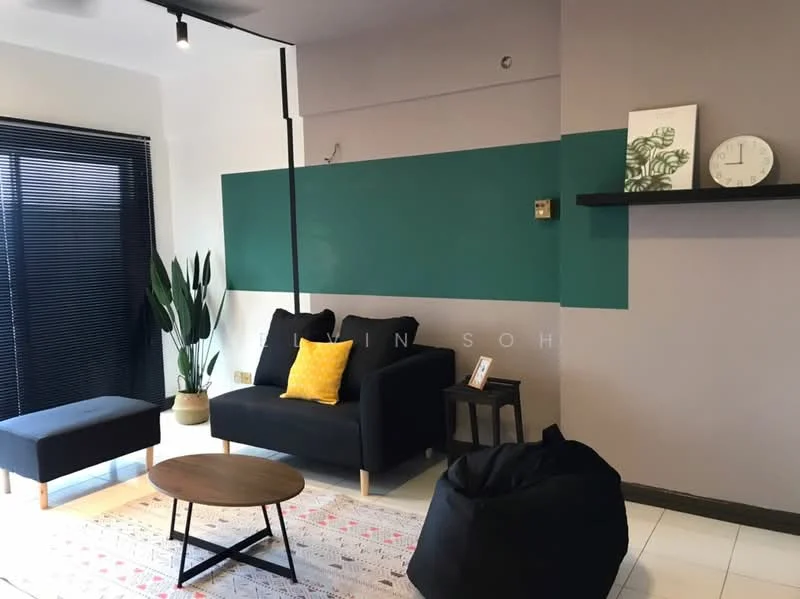 Living features: black fabric sofa, yellow accent pillow, black ottoman, round wooden coffee table, area rug with geometric pattern, green accent wall, light grey painted walls, floor-to-ceiling windows with black blinds, indoor plant in pot, wall clock; style: modern.