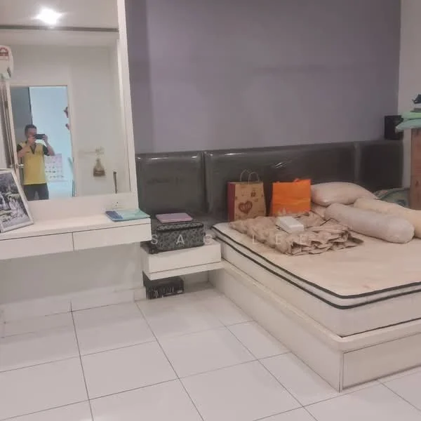 Bedroom features: white painted walls, grey accent wall, white tiled flooring, queen-size bed, upholstered headboard, built-in wardrobe, dressing table with mirror, decorative items on the table, two large cushions, shopping bags, photo frame, mirror, light source from ceiling; style: modern.