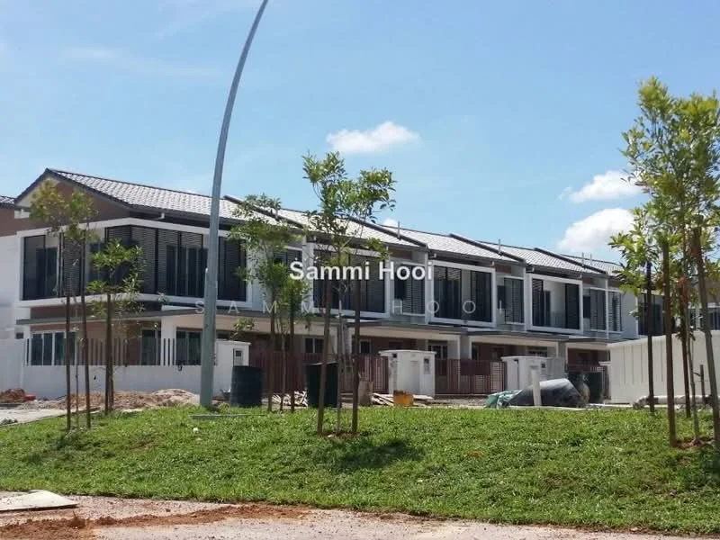 Exterior type: linked terrace house; features: two-storey building, grey painted facade, pitched tile roof, recessed balconies, white window frames, manicured lawn, young trees planted, paved walkway, construction materials visible, surrounded by greenery; style: modern.