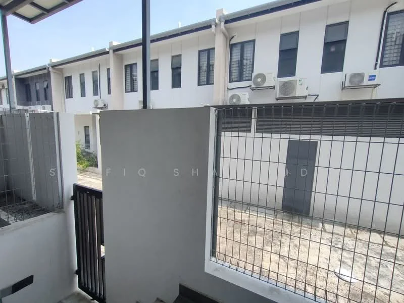 Exterior type: linked terrace house; features: white painted facade, metal grilles on windows, visible air conditioning units, concrete walkway, fenced perimeter, gated entry, manicured landscaping, two-storey structure; style: modern.