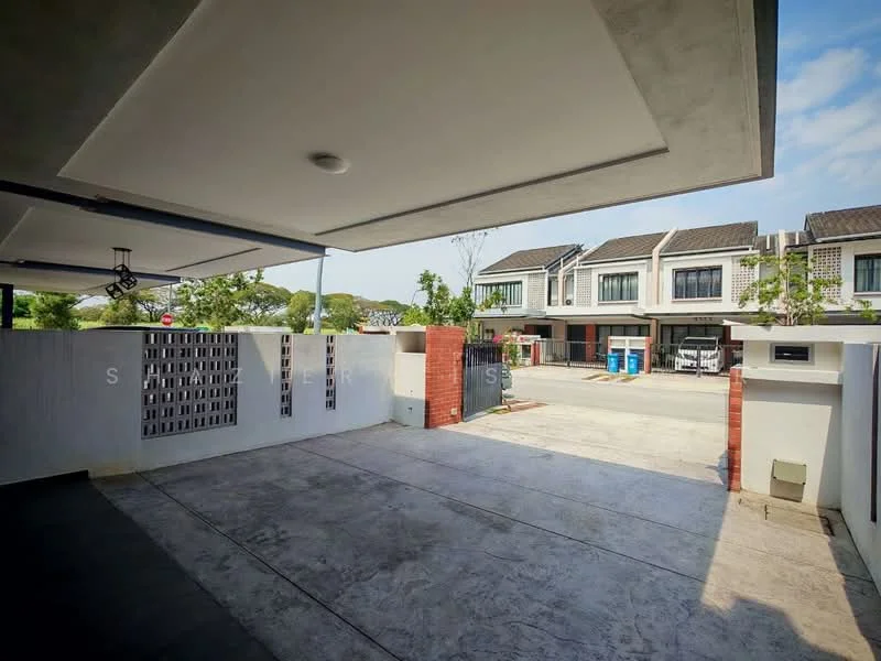 Exterior type: linked terrace house; features: concrete driveway, exposed aggregate flooring, white painted walls, brick feature wall, manicured landscaping, two-storey linked terrace houses in background, visible parking spaces, street view, security gate, outdoor lighting; style: modern.