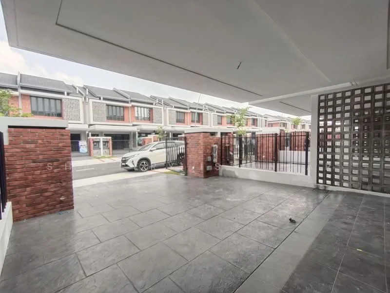 Exterior type: linked terrace house; features: paved driveway, brick feature wall, metal gate, covered car porch, surrounding fencing, front yard area, two-storey linked terrace houses in background, concrete flooring, landscaped area with plants; style: modern.