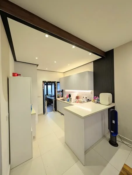 Kitchen features: white cabinetry, grey upper cabinets, white countertop, stainless-steel sink, chrome pull-down faucet, built-in microwave, refrigerator, ceramic tile flooring, recessed downlights, exposed beams, open layout, wall-mounted fan, black accent wall; style: modern.