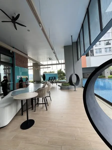 Room features: large windows, ceiling fan, wooden flooring, bar counter, stools, indoor plants, open layout, pool view, decorative circular elements, modern lighting, neutral color palette, high ceiling; style: modern; view: pool.