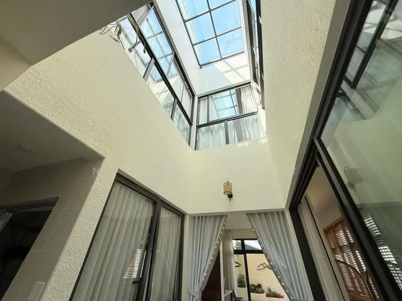 Room features: glass ceiling, white textured walls, floor-to-ceiling windows, sheer curtains, light fixtures, open space, natural light, interior balcony; style: modern; view: sky.