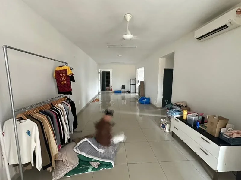 Room features: white painted walls, glossy tile flooring, ceiling fan, wall-mounted split AC, open shelving rack with clothes, storage cabinet, various boxes and items on the floor.
