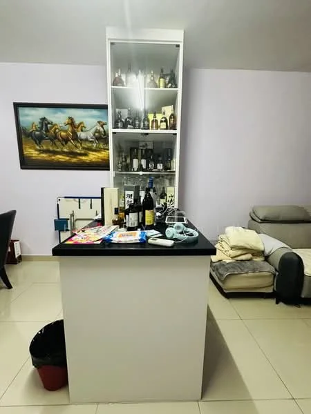 Room features: white cabinetry, black countertop, glass display cabinet with bottles, cream-colored sofa, tile flooring, purple painted walls, framed artwork of horses, waste bin, various bottles on countertop, assorted items on countertop; style: modern.