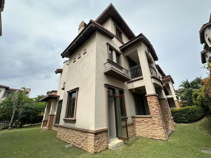 Exterior type: detached bungalow; features: cream painted facade, stone cladding at the base, recessed balconies, pitched tile roof, two-storey structure, manicured lawn, surrounded by greenery, large windows, balcony with railing; style: modern.