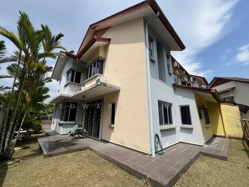 Exterior type: semi-detached house; features: two-storey structure, cream painted facade, yellow painted wall, red tiled roof, sliding windows, patio area with tiled flooring, manicured lawn, palm trees, outdoor seating area, garden hose visible; style: modern.