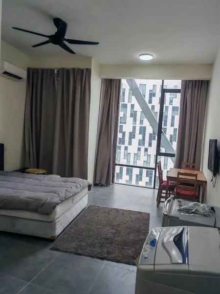 Room features: queen-size bed, grey bedding, 5-blade ceiling fan, floor-to-ceiling windows, curtains in brown, wooden dining table with chairs, wall-mounted TV, area rug with solid pattern, washing machine, grey tiled flooring, air conditioning unit; style: modern; view: city.
