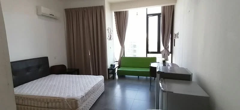 Bedroom features: queen-size bed with mattress, green fabric sofa, grey side table, silver fridge, floor-to-ceiling window, sheer curtains, air conditioning unit, grey tile flooring, white painted walls; style: modern; view: city.