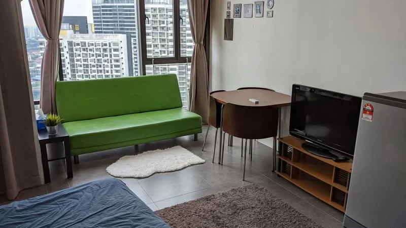 Living features: green fabric sofa, round dining table, 2 dining chairs, TV console, flat-screen TV, refrigerator, area rug, floor-to-ceiling windows, curtains, grey tiled flooring; style: modern; view: city.
