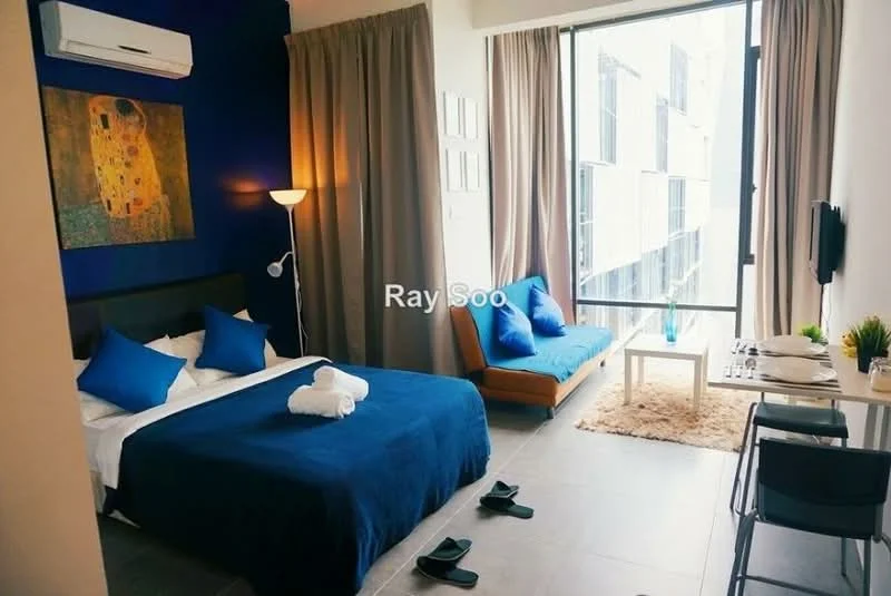 Bedroom features: king-size bed with white bedding, blue accent pillows, upholstered headboard, floor-to-ceiling windows, curtains in beige, wall-mounted TV, sofa bed in orange, side table with lamp, dining table with two chairs, decorative artwork on wall, air conditioning unit, grey tile flooring; style: modern; view: city.
