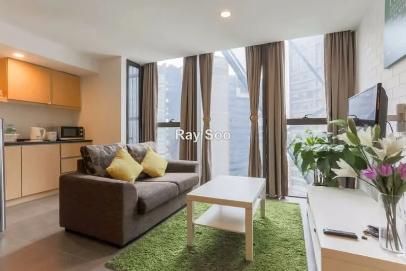 Living features: 3-seater fabric sofa in grey, yellow decorative cushions, white coffee table, green area rug, floor-to-ceiling windows, curtains in beige, wall-mounted TV, TV console, decorative plants in ceramic pots, light grey walls, tile flooring, open kitchen area with cabinetry; style: modern; view: city.