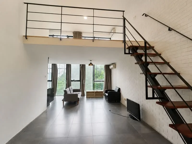 Living features: grey fabric sofa, black armchair, wooden coffee table, TV console, wall-mounted TV, large windows with city view, white painted walls, exposed brick wall, recessed downlights, metal railing staircase, grey tile flooring; style: modern; view: city.