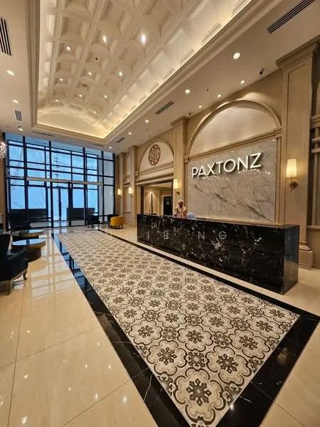 Lobby features: coffered ceiling with recessed lighting, marble flooring, black marble reception desk, decorative wall with marble cladding, large glass windows, upholstered seating in black, ornate area rug with geometric pattern, wall sconces, decorative clock on wall, elegant wall paneling; style: luxury; view: city.