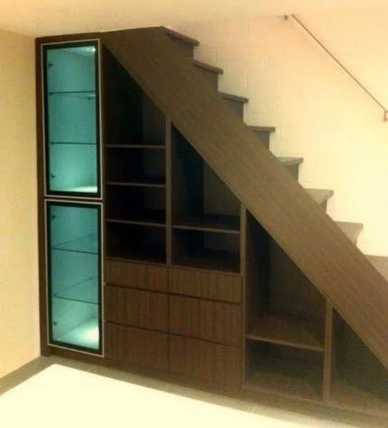 Room features: wooden staircase, built-in storage under stairs, glass display cabinet, dark wood cabinetry, open shelving, drawers, white wall, tile flooring; style: modern.