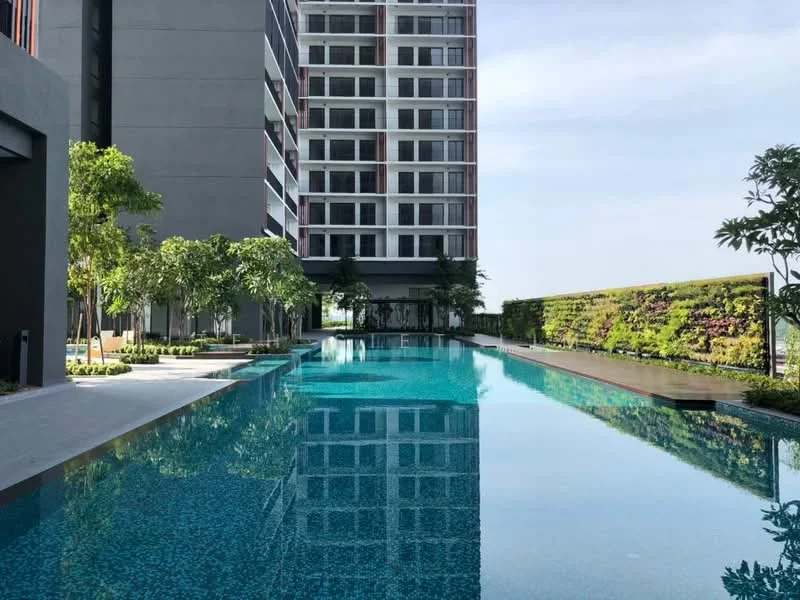 Exterior type: high-rise condominium; features: infinity pool, pool deck with loungers, landscaped garden area, mature trees, vertical greenery, modern architectural design, glass curtain wall, surrounded by water features; style: modern.