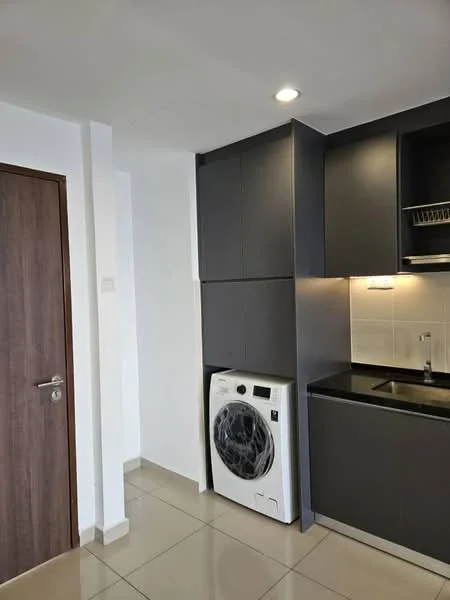 Kitchen features: dark cabinetry, black countertop, single-bowl stainless-steel sink, chrome pull-down faucet, built-in washing machine, white tiled backsplash, recessed downlights, ceramic tile flooring; style: modern.