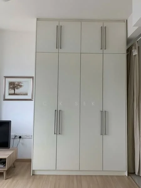 Room features: built-in wardrobe with sliding doors, white cabinetry, six cabinet doors, metal handles, light wood flooring, neutral wall colour, minimalist design, decorative artwork on wall; style: modern.