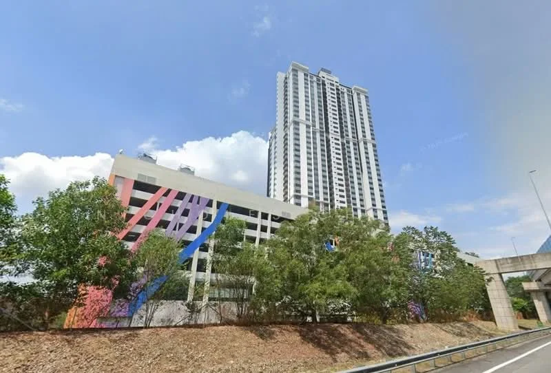 Exterior type: high-rise condominium; features: glass curtain wall, exposed concrete facade, multi-storey car park, manicured landscaping, mature trees, colorful geometric patterns on parking structure, surrounded by greenery, adjacent to highway; style: modern.