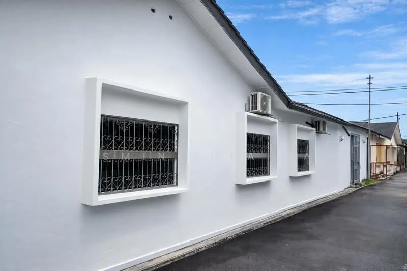 Exterior features: white painted facade, metal grilles on windows, 2 wall-mounted split AC units, flat roof, paved driveway, surrounded by residential buildings; style: modern.