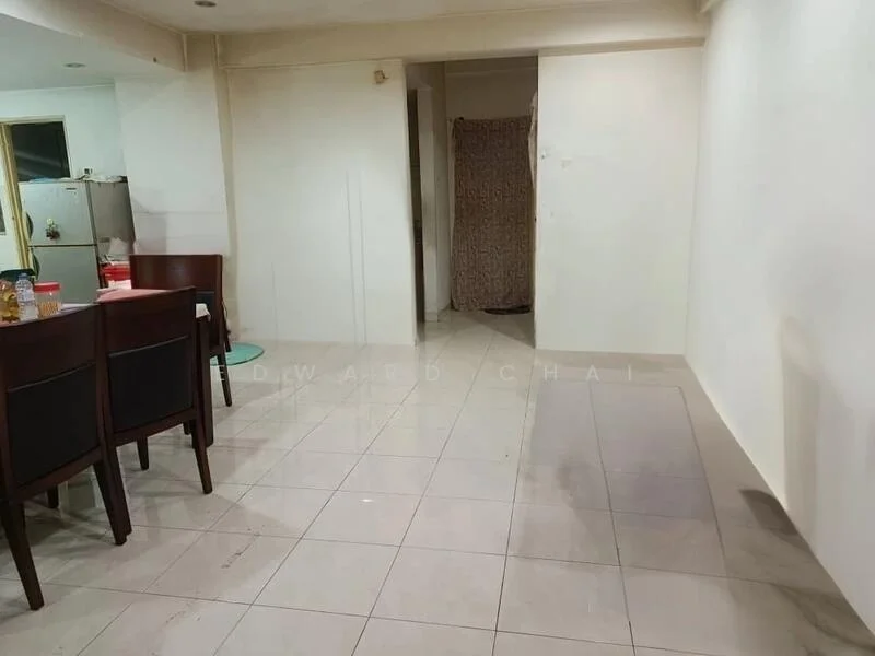 Room features: white painted walls, tile flooring, dining table with chairs, refrigerator, doorway leading to another room, curtains, light fixtures, empty wall space.